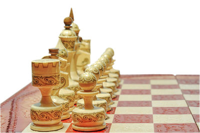 Close-up of chess pieces on the background