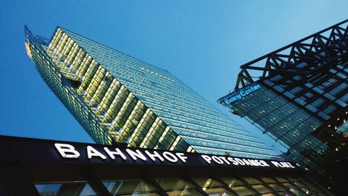 Low angle view of built structure against clear blue sky