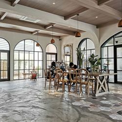 Empty chairs and tables in building