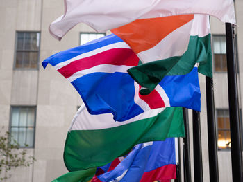 Low angle view of flag against building