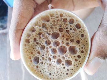 Close-up of hand holding coffee