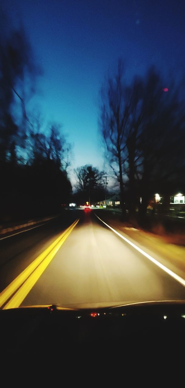 VIEW OF ROAD SEEN THROUGH WINDSHIELD