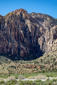 Scenic view of rocky mountains against clear sky