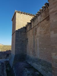 Low angle view of fort against clear sky