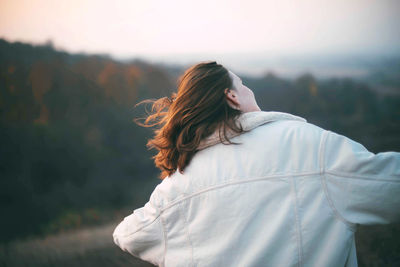 Portrait of a young woman on a sunny day in autumn