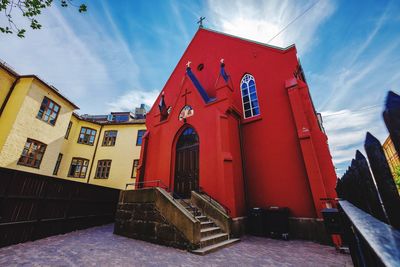 Low angle view of red building against sky