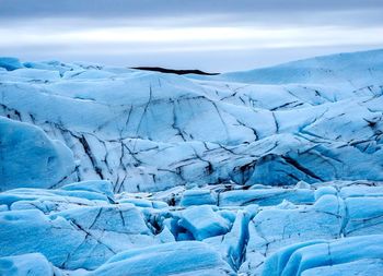 Scenic view of snow covered mountains