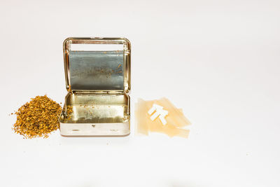 High angle view of bread on glass against white background