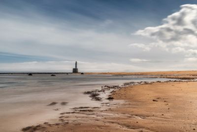 Scenic view of beach against sky