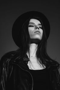 Close up of beautiful young woman wearing hat