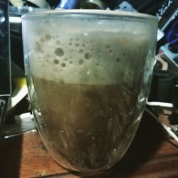 Close-up of beer glass on table