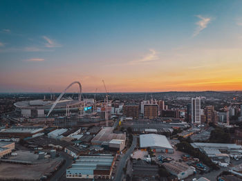 High angle view of buildings against sky during sunset