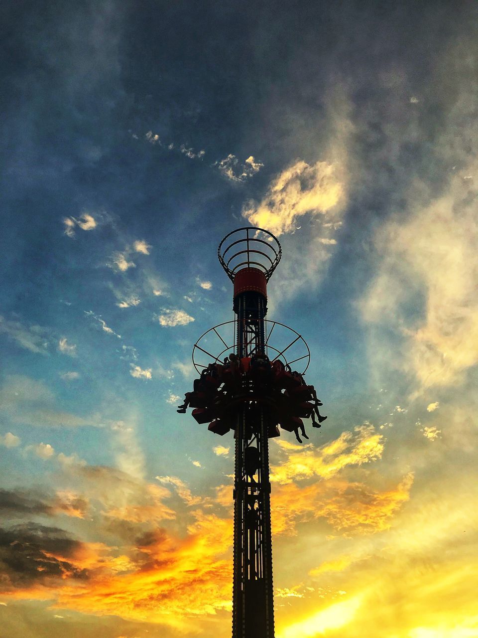 LOW ANGLE VIEW OF SILHOUETTE COMMUNICATIONS TOWER AGAINST ORANGE SKY