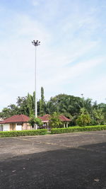 Street by building against sky