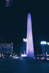 View of skyscrapers lit up at night