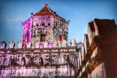 Low angle view of built structure against blue sky