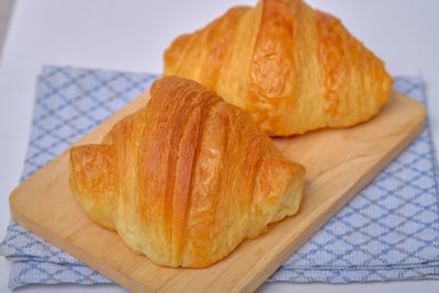 High angle view of bread on cutting board