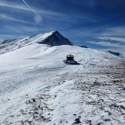 Scenic view of snow covered mountains