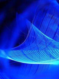 Digital composite image of light painting against black background