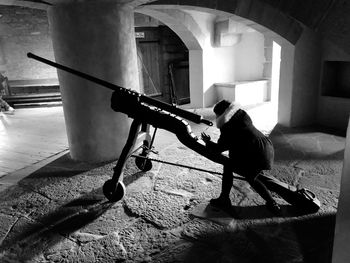 Side view of a man working on floor