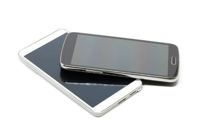 Low angle view of smart phone against white background