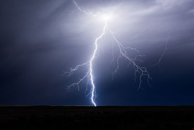 Low angle view of light trails at sunset