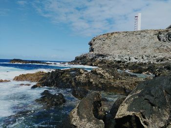 Scenic view of sea against cloudy sky