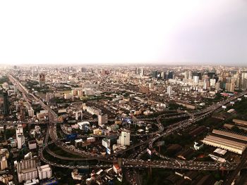 High angle view of city buildings against clear sky