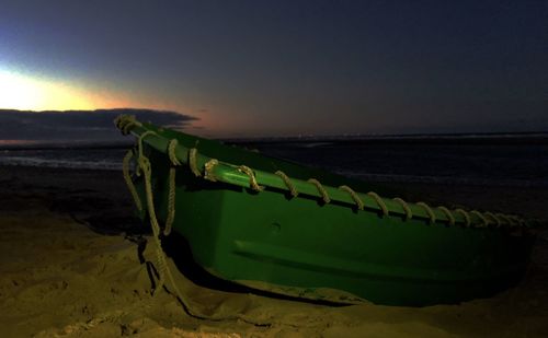 Scenic view of beach against sky during sunset