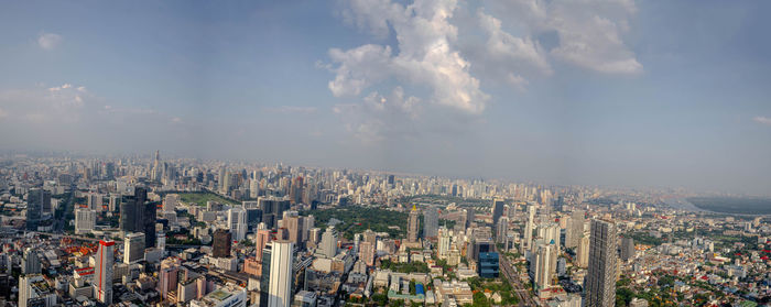 High angle view of modern buildings in city against sky