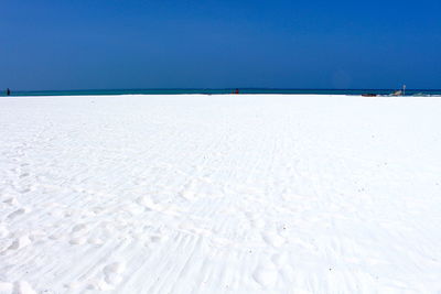 Scenic view of sea against clear blue sky