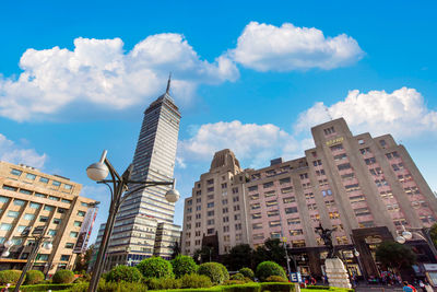 Low angle view of buildings against blue sky