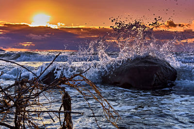 Scenic view of frozen sea against sky during sunset