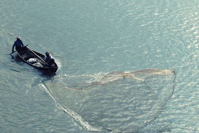 High angle view of man on boat in sea