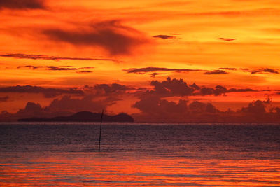 Scenic view of sea against romantic sky at sunset