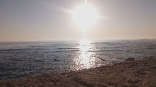 Scenic view of sea against clear sky during sunset