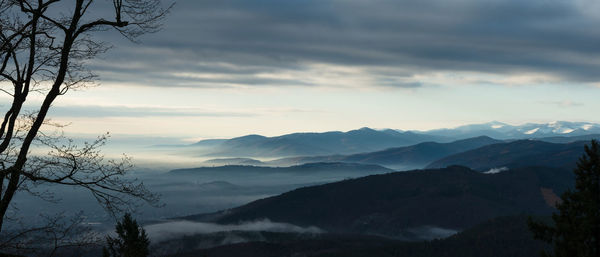 Scenic view of mountains against sky during sunset
