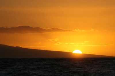 Scenic view of sea against romantic sky at sunset