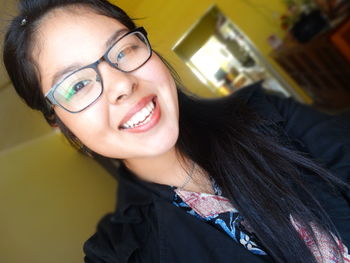 Portrait of young woman in car