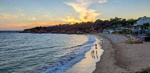 Panoramic view of beach against sky during sunset