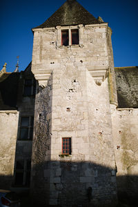 Low angle view of old building against sky