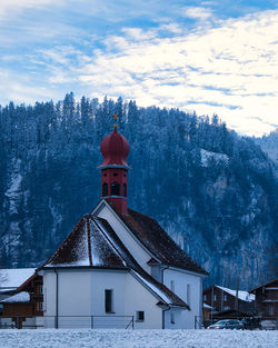 Building against sky during winter