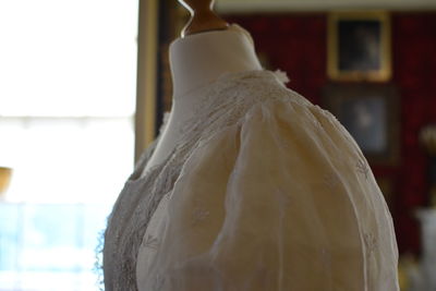 Close-up of clothes hanging on white wall