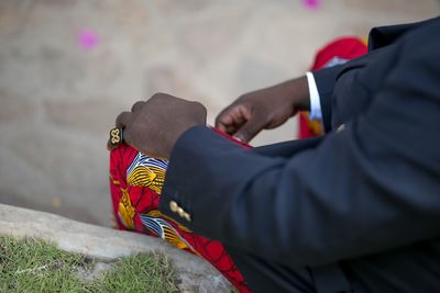 Low section of man relaxing on cross