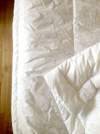 Close-up of white bed