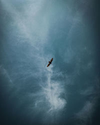 Low angle view of airplane flying in sky