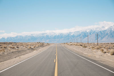 Road amidst landscape against sky