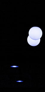 View of illuminated ferris wheel at night