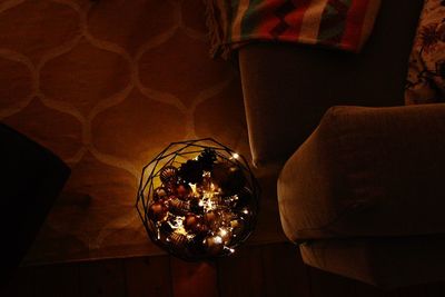 Close-up of illuminated sofa at home