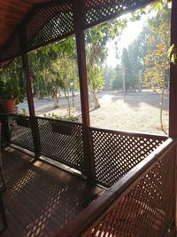 View of swimming pool seen through window